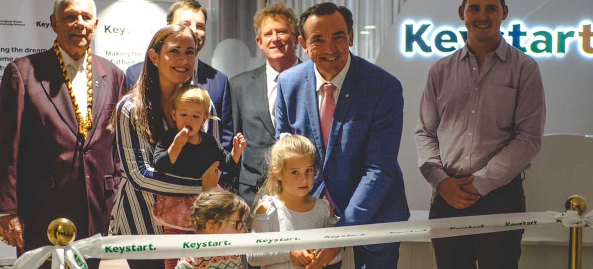 Ribbon cutting with Minister and customers