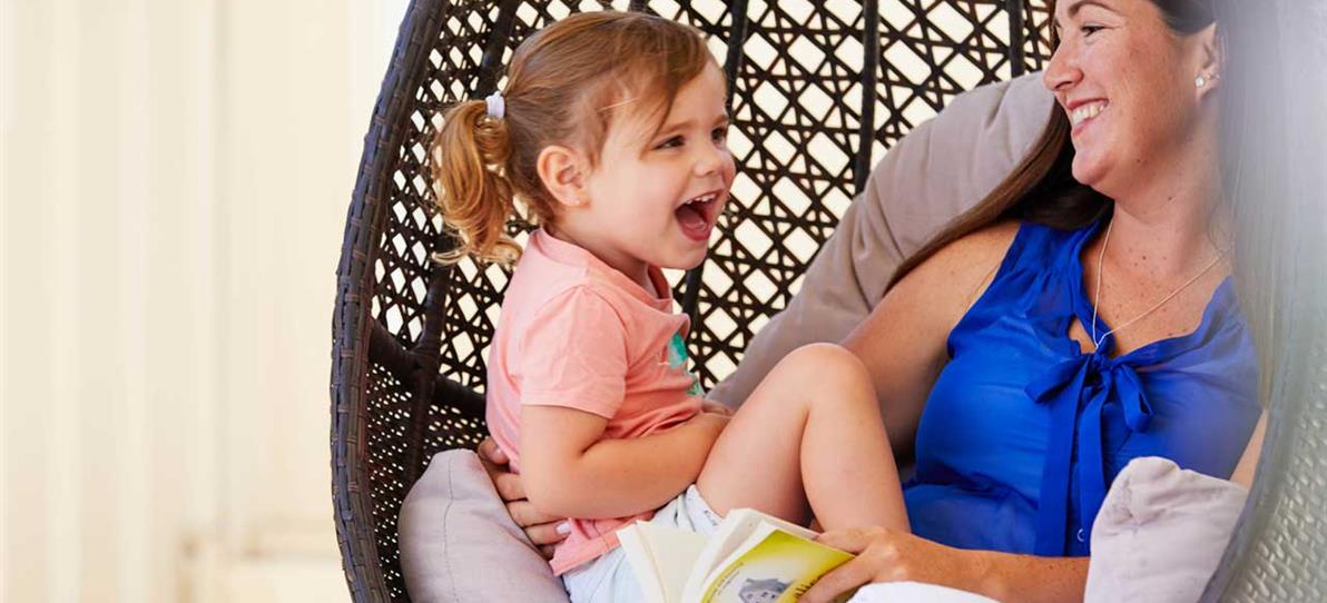 woman with child on chair outside