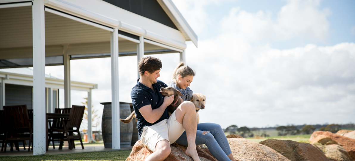 couple with dogs at home