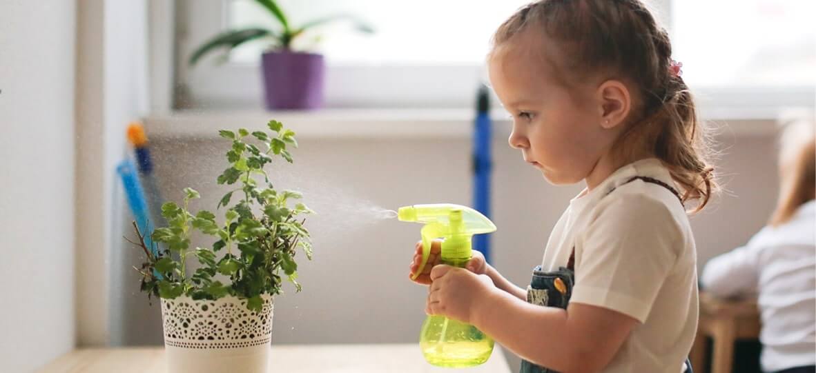 girl watering plant