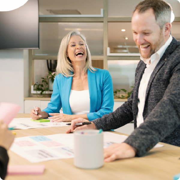 Two Keystart employees laughing together.